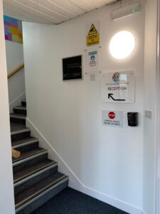 Stairwell landing with practice safety signs