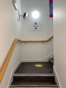 Stairwell landing with practice safety signs