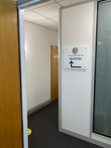 Doorway with a sign directing patients to reception
