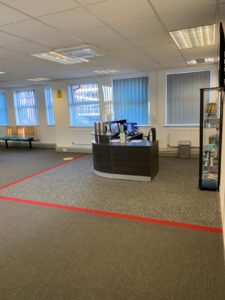 Reception and waiting room marked out for social distancing