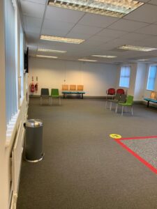 Reception and waiting room marked out for social distancing