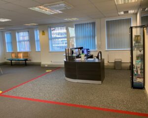 Reception and waiting room marked out for social distancing