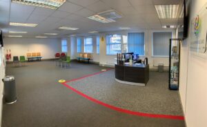 Reception and waiting room marked out for social distancing