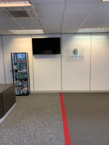 Reception area with a one-way floor marking