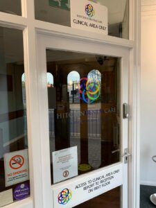 Clinical area door with social distancing notices