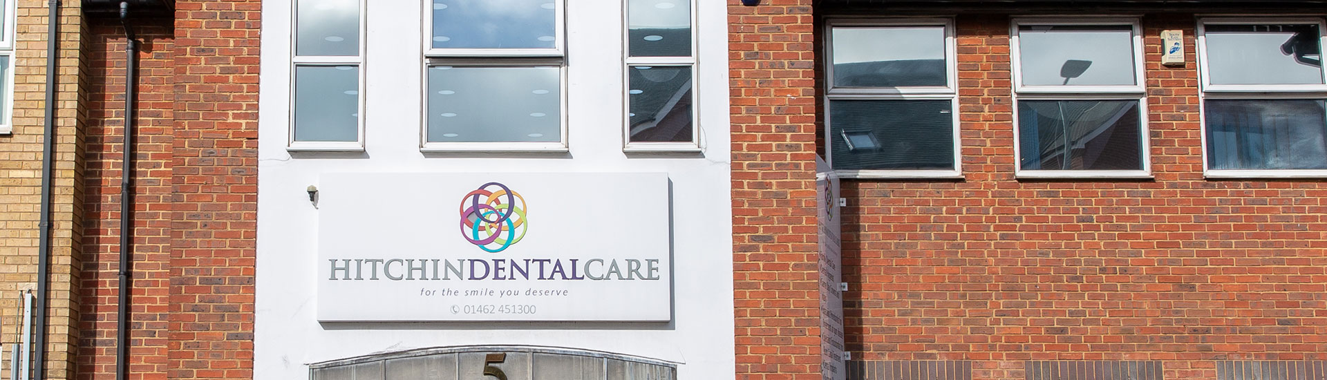 The front of Hitchin Dental Care, with the practice sign above the entrance