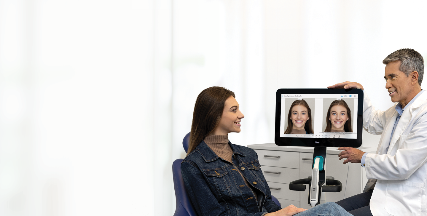 Dentist showing a patient her iTero intraoral scan on screen