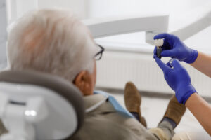 Older patient in the dental chair during an implant consultation